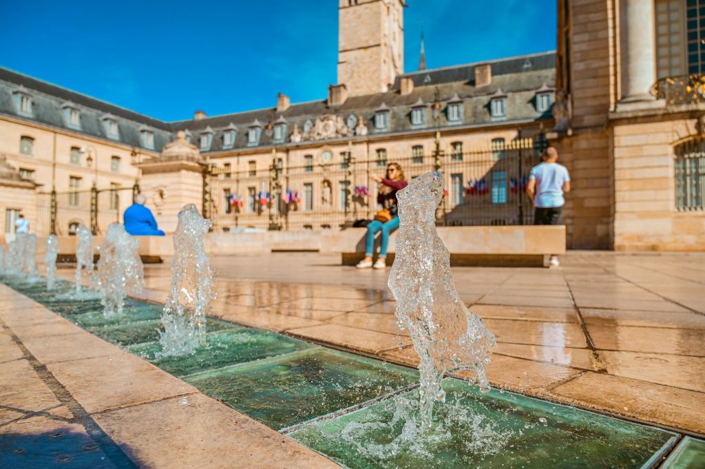 Spending time by the water fountains at the magnificent Dijon square in France